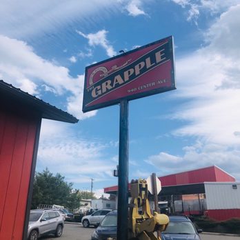 The Grapple - a sign on a pole in a parking lot - Beer Bar Near Me - Saint Maries, Idaho The Grapple - a sign on a pole in a parking lot - Beer Bar Near Me - Saint Maries, Idaho