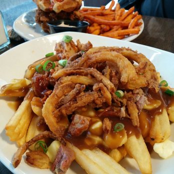 St. Louis Bar & Grill - Top: chicken and waffles, bottom: pulled pork poutine - Chicken Wings Near Me - Vaughan, Ontario