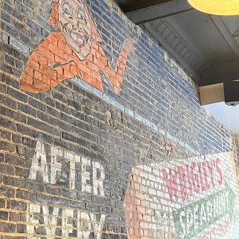 The Wrigley Taproom & Eatery - Old advertisement on the inside brick wall. - New American Near Me - Corbin, Kentucky The Wrigley Taproom & Eatery - Old advertisement on the inside brick wall. - New American Near Me - Corbin, Kentucky