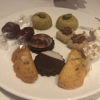 Centurion New York - Complimentary dessert plate: Almond Marsh-mellow (green thing), chocolate (crepe textured) cookie, almond biscuit, some nutty square cookie - French Near Me - New York, New York
