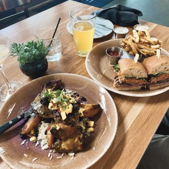 The Cut - Jerk Chicken Plate on the left, Banh Mi sandwich to the right - Cocktail Bars Near Me - Rancho Cucamonga, California