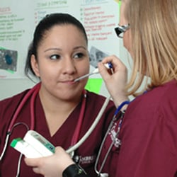Cambridge Junior College Medical Assistant students getting some hands-on experience.