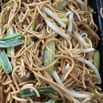 Rongwang Restaurant - Soy sauce fried noodles - A close-up of soy sauce fried noodles mixed with bean sprouts, green onions, and other vegetables, served in a takeout container. - Noodles Near Me - Flushing, New York