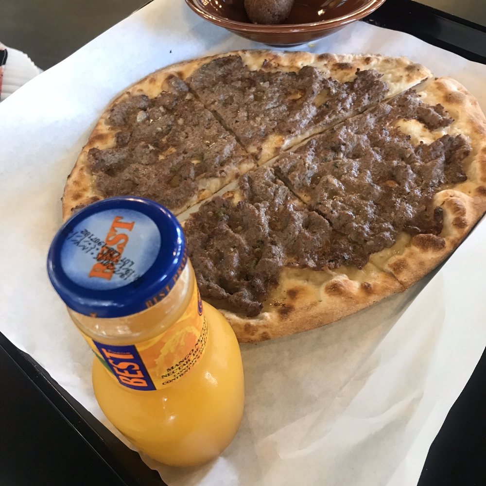 The Root Of Beirut - Manakeesh Za'atar with orange juice. - Mediterranean Near Me - Edmonton, Alberta The Root Of Beirut - Manakeesh Za'atar with orange juice. - Mediterranean Near Me - Edmonton, Alberta