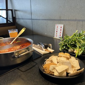 Happy Lamb Hot Pot - a plate of food on a counter - Mongolian Near Me - Edison, New Jersey Happy Lamb Hot Pot - a plate of food on a counter - Mongolian Near Me - Edison, New Jersey