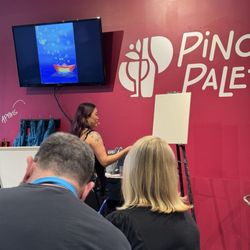 Pinot's Palette - View of the instructor and TV that showed a larger closeup of her painting so we could easily follow.