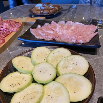 Ishoni Yakiniku - Zucchini with shiitake mushroom in the back and pork jowl - Barbeque Near Me - Seattle, Washington