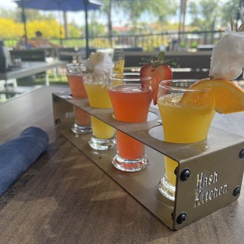 Hash Kitchen - Orange, strawberry, pineapple, blueberry Mimosa flight with cotton candy glitter bombs - Breakfast & Brunch Near Me - Chandler, Arizona Hash Kitchen - Orange, strawberry, pineapple, blueberry Mimosa flight with cotton candy glitter bombs - Breakfast & Brunch Near Me - Chandler, Arizona