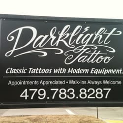 Dark Light - Sign out front