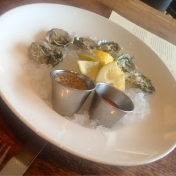 Finch & Fork - West Coast oysters with lemon, garlic butter and cocktail sauce - New American Near Me - Santa Barbara, California