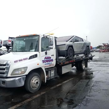 Able Towing & Roadside - Transporting a Tesla Cybertruck for 24/7 Towing, Roadside, and Exotic transport call Able Towing 407-866-3464 - Towing Near Me Able Towing & Roadside - Transporting a Tesla Cybertruck for 24/7 Towing, Roadside, and Exotic transport call Able Towing 407-866-3464 - Towing Near Me