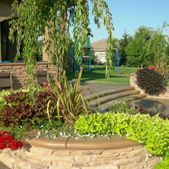 Environmental Landscape - a circular planter in a backyard - Landscaping Near Me Environmental Landscape - a circular planter in a backyard - Landscaping Near Me