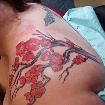 Amillion Tattoos & Body Piercing - Gorgeous cherry blossom branch on shoulder - Tattoo Near Me - Austin, Texas