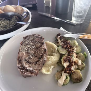 Ruhlman's Steakhouse - Spinach and artichoke dip, Delmonico ribeye mash potatoes and Brussel sprouts. - Steakhouses Near Me - Ashland, Nebraska Ruhlman's Steakhouse - Spinach and artichoke dip, Delmonico ribeye mash potatoes and Brussel sprouts. - Steakhouses Near Me - Ashland, Nebraska