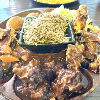 Reggae Jerk Hut - Taste of Jamaica here you can see the oxtails, stewed chicken and jerk chicken with the rice. - Caribbean Near Me - McKinney, Texas