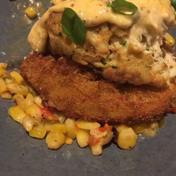Paddlefish - Crab cake on top of a fried green tomato and maque choux. Sooo good! - Seafood Near Me - Orlando, Florida