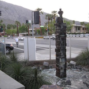 Koffi - An artsy-fartsy sculpture inside a water feature. Can you see the edge of the Biltmore condo complex across the street? The mountains? - Coffee & Tea Near Me - Palm Springs, California Koffi - An artsy-fartsy sculpture inside a water feature. Can you see the edge of the Biltmore condo complex across the street? The mountains? - Coffee & Tea Near Me - Palm Springs, California