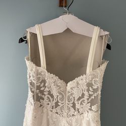 Wedding dress with straps clearly terrible craftsmanship