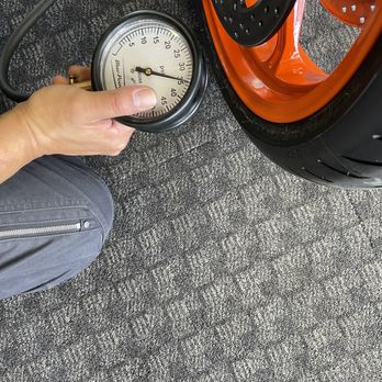 New Century BMW Motorcycles - kc in action verifying the tire pressure - Motorcycle Dealers Near Me - Alhambra, California New Century BMW Motorcycles - kc in action verifying the tire pressure - Motorcycle Dealers Near Me - Alhambra, California