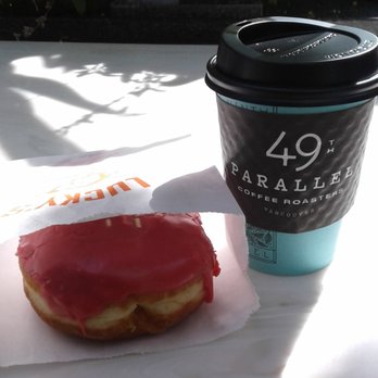 49th Parallel Coffee - Mango Passionfruit Doughnut and coffee - Coffee & Tea Near Me - Vancouver, British Columbia