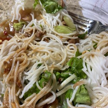 Pho Barr - Bowlful of noodles from 2 pork spring rolls. Brown is peanut sauce. Little to no meat. - Vietnamese Near Me - Dickinson, Texas