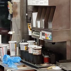 McDonald's - Drink pouring machine at the drive thru window.