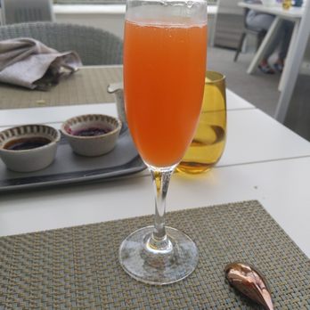 Ponto Lago - Carrot and pineapple mimosa - New American Near Me - Carlsbad, California
