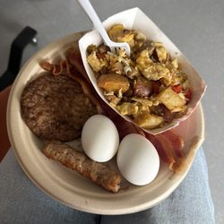 Kaiser Permanente Cafeteria - Breakfast sausage, boiled eggs, bacon strips, sausage patty, s rambled eggs with vegetables and potatoes