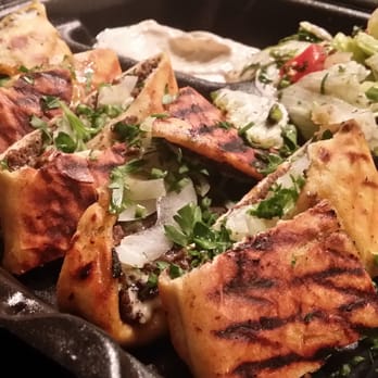 Shish Grill - #12, Lavash Wrap (Ground beef and lamb on pita bread, topped with onions, tomatoes, parsley and Shish specialty garlic sauce)... - Mediterranean Near Me - San Ramon, California