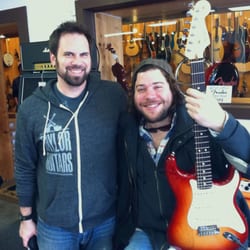 Larry's Music Center - Gabriel gives Josh Krajcik a Fender Stratocaster.