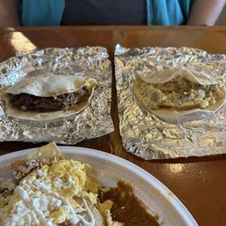 Chilaquiles with brisket/egg and sausage/egg tacos