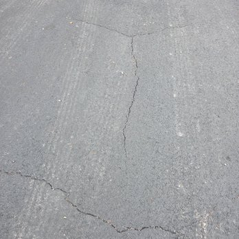 North Alabama Striping and Seal Coat - Cracks that weren't filled. - Masonry/Concrete Near Me - Sheffield, Alabama North Alabama Striping and Seal Coat - Cracks that weren't filled. - Masonry/Concrete Near Me - Sheffield, Alabama