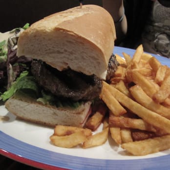 BXL Cafe - Mitraillette - burger steak, fries on a French baguette with tangy sauce - Pubs Near Me - New York, New York