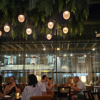 Alpana - Dining area, art work & food. - New American Near Me - Chicago, Illinois