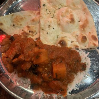 Godavari Austin - Chicken vindaloo over basmati rice with Butter Naan - Indian Near Me - Austin, Texas Godavari Austin - Chicken vindaloo over basmati rice with Butter Naan - Indian Near Me - Austin, Texas