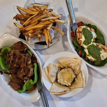 Check Please Cafe - On the left is a stuffed green pepper and on the right is the pesto chicken (mine). Rounding out these are fries and pita with hummus. - Breakfast & Brunch Near Me - Grafton, Ohio Check Please Cafe - On the left is a stuffed green pepper and on the right is the pesto chicken (mine). Rounding out these are fries and pita with hummus. - Breakfast & Brunch Near Me - Grafton, Ohio