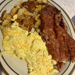 Corned beef hash with scrambled cheese eggs and home fries