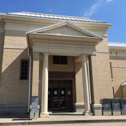 Cragin Memorial Library - The back entrance has drop off boxes for returns, direct access to the kids section, a staircase and an elevator upstairs.