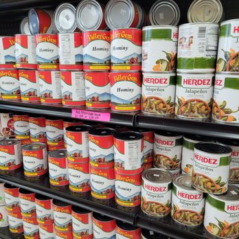 Town Talk - a shelf of canned food in a grocery store - Grocery Near Me - Arlington, Texas