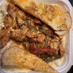 SnoCreation - Chicken Alfredo pasta with peppers and onions. Delicious!!!