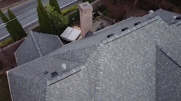 Slide of DIM Construction and Roofing