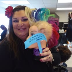 Robert Fiance Beauty Schools - Miss Lisa Head Cosmetologist/Instructor with one of her fun creations. RFBS even offers funky cuts, colors for the adventurous.