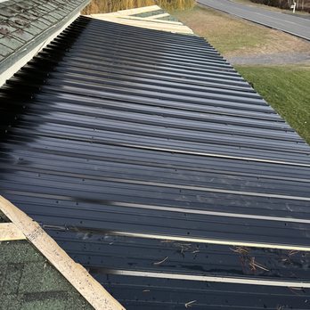 Jakes General Contracting - a flat metal roof being installed - Roofing Near Me - Ellenburg, New York Jakes General Contracting - a flat metal roof being installed - Roofing Near Me - Ellenburg, New York