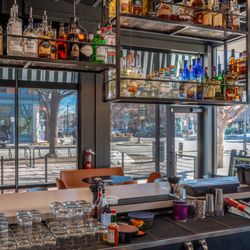 South Broadway Country Club - Dog friendly outdoor patio on the corner of Linden and Walnut Streets.