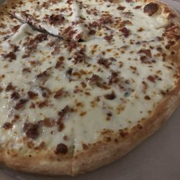 Brooklynn style pizza with extra sauce and no discernible cheese. Brooklynn style pizza with extra sauce and no discernible cheese.