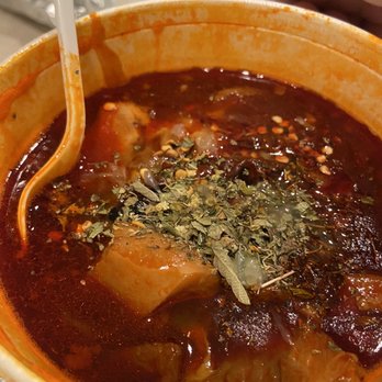 El Milagro restaurant - a bowl of soup with a spoon in it - Mexican Near Me - Seaside, California El Milagro restaurant - a bowl of soup with a spoon in it - Mexican Near Me - Seaside, California