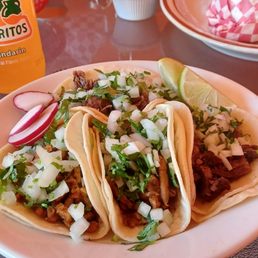 Al pastor and head tacos. Al pastor and head tacos.