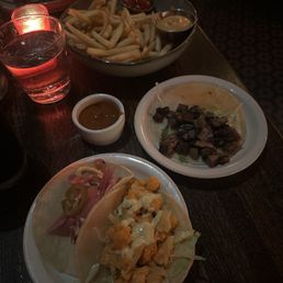 Tempura Battered Fish Taco, Roasted Cauliflower Taco, carne asada tacos, and French Fries Tempura Battered Fish Taco, Roasted Cauliflower Taco, carne asada tacos, and French Fries