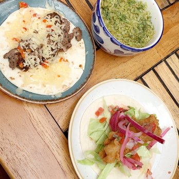 Nada - plates of food on a wooden table - Mexican Near Me - Columbus, Ohio
