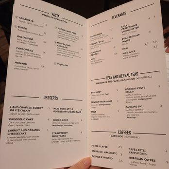 Pizzédélic - a person holding a menu - Pizza Near Me - Montreal, Quebec
